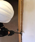 Heavy Duty Indexing Crowbar And Nail Puller Wrecker Tool Boasting Multi Angle Locking Head in use for demolition work