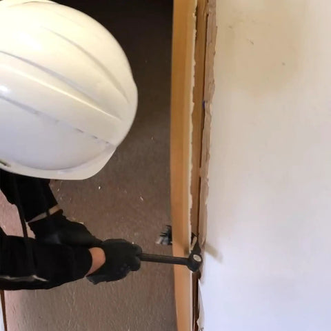 Heavy Duty Indexing Crowbar And Nail Puller Wrecker Tool Boasting Multi Angle Locking Head in use for demolition work