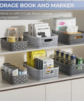 3 Pack Small Plastic Storage Baskets In Sleek Dark Gray For Hassle Free Home Organization And Pantry Reset With Heavy Duty Wicker Look Design A Fast Fix For Bedroom Kitchen Laundry Cabinet Countertop on shelf with items.