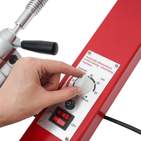 Hand adjusting settings on Spot Tire Vulcanizing Kit For Cars And Trucks 110V With 6 Molds, DIY Garage Tire Repair Tool