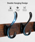 Close-up of black metal hooks on a rustic wood panel, part of 29 Inch Rustic Wall Coat Rack With Shelf And Hooks Entryway Organizer For Living Room Bedroom Or Bathroom Heavy Duty Black Finish 80 Lbs Capacity Perfect Storage And Display