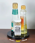 6 Inch Black Lazy Susan Turntable With Ball Bearing, 360 Degree Rotation, holding spice bottles, on a wooden table.