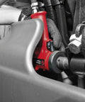 Half Inch Air Impact Wrench With Aluminum Body And Steel Front Cover Delivers 450 Foot Pounds Of Torque 610 Newton Meters 9000 RPM One Hand Operation Jumbo Hammer Ergonomic Pistol Grip For Heavy Duty Auto Shop Use being used on machinery