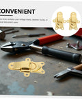 Classic Antique Golden Toggle Latch Zinc Alloy Duckbilled Hasp Lock on workbench with tools, perfect for toolbox and storage.