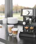 At Home Barista Style Manual Espresso Machine With 15 Bar Pump on kitchen counter with steamed milk and espresso shots.