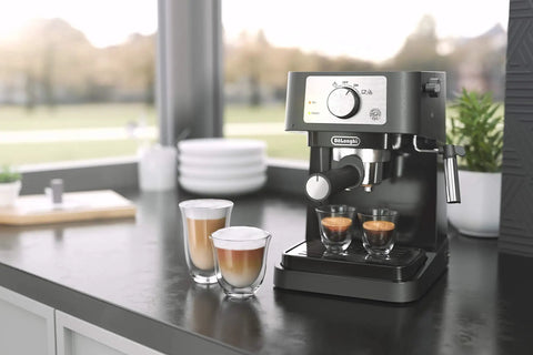 At Home Barista Style Manual Espresso Machine With 15 Bar Pump on kitchen counter with steamed milk and espresso shots.