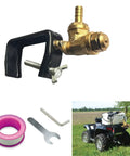 Boomless Spray Nozzle For ATV Sprayers With Brass Orifices 10 And 12, shown with clamp and tools, mounted on ATV in field