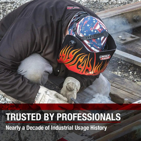 Welder wearing All American Stars And Stripes Welding Cap With Mesh Inside Liner, working on railway tracks, flame design helmet.