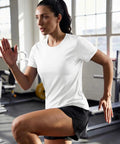 Woman exercising in gym wearing Women's Short Sleeve Athletic Tee With UPF 50+ Sun Protection, Quick Dry Moisture-Wicking Workout Top