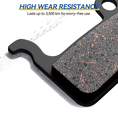 Close-up of Four Pairs Semi Metallic Mountain Bike Disc Brake Pads with textured surface and high wear resistance lettering.