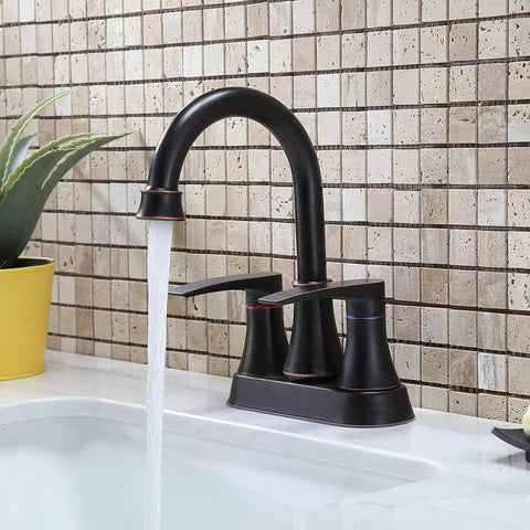 Lead Free Two Handle Oil Rubbed Bronze Bathroom Sink Faucet With 360 Degree Swivel High Arc Spout installed on a white sink