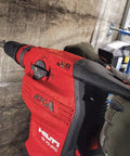Worker using Beast 120 Volt SDS Max Corded Rotary Hammer Drill Kit with AVR Vibration Reduction Includes TE 70 Rotary Hammer
