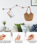 Sunset Ocean Gold Cabinet Knobs 2 In 1 Acrylic Drawer Pulls Featuring Game Changing Wall Hardware Heavy Duty Build For Kitchen Cupboards And Dressers Comes As A Straight Up 4 Pack With Screws Included displayed on wall with a calendar and bag.