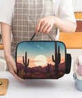 Hand holding Insulated Desert With Cactus Lunch Box With Leakproof Design Reusable Lunch Tote Bag With Extra Pockets Durable Cooler Lunch Container