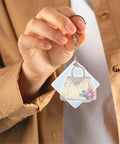 Six Piece Double Sided Diamond Painting Keychain Kit Set For Beginners And Adults held by a hand, featuring a bag ornament.