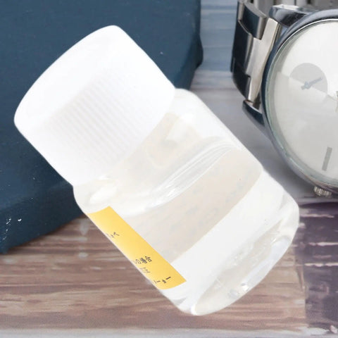 Close-up of a bottle from Stainless Steel Oil Dropper Kit For Watchmakers Precision Lubrication Tool with Fine Tip and Anti Clog Design.