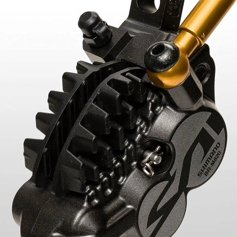 Close-up of Saint M820 Hydraulic Disc Brake and Lever Front Post Mount 4 Piston Caliper with I Spec B Reach Adjust feature.