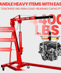 Heavy Duty 2 Ton 4400 Lbs Engine Hoist Folding Alloy Steel Cherry Picker lifting an engine with adjustable boom and hydraulic pump.