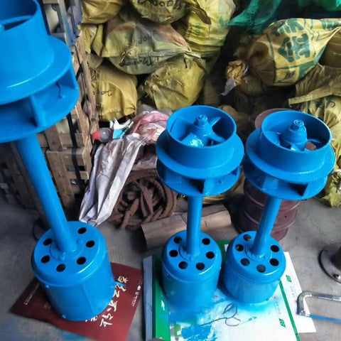 Three blue Rugged 2000W Hydroelectric Generator For Off Grid Power 220V Single Phase Axial Flow Water Turbine units stacked.
