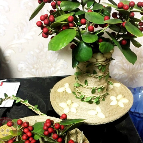Decorative arrangement wrapped with Natural Green Leaf Jute Twine Rope 2mm 3-Ply with red berries and leaves