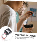 Two individuals working with the Zero Fluff 24V Heavy Duty Battery Equalizer Voltage Balancer for accurate cell balancing.