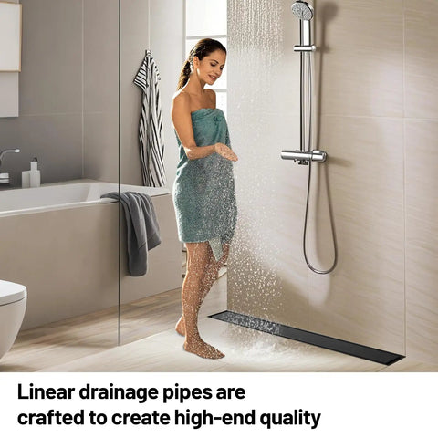 12 Inch Black Linear Shower Drain Crafted From Premium 304 Stainless Steel Featuring Adjustable Leveling Feet in a modern shower.