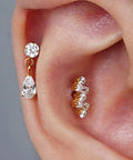 Top Shelf Titanium Cartilage Earring Flat Back Stud Featuring Interchangeable 6mm And 8mm Posts Secure Screw On Design Built For Tragus Conch Helix Piercing Elevates Your Ear Game, showcasing a sparkling drop design with clear gemstones.