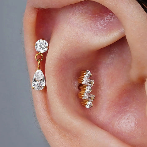 Top Shelf Titanium Cartilage Earring Flat Back Stud Featuring Interchangeable 6mm And 8mm Posts Secure Screw On Design Built For Tragus Conch Helix Piercing Elevates Your Ear Game, showcasing a sparkling drop design with clear gemstones.