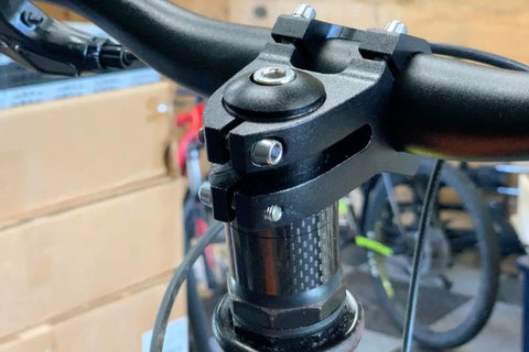 Close-up of an Aluminum Bike Stem Riser Extension 150mm for One And One Eighth Inch Steerer with 28.6mm base, black color.