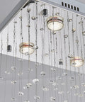 Close-up of Lit 8 Light K9 Crystal Modern Flush Mount Ceiling Light Fixture With Raindrop Crystal Chandelier Glass Drops, bulbs visible