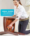 Black+Decker 109-piece drill and screwdriver bit set; cordless drill in use assembling wooden furniture.