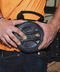 Person holding a Tie Wire Reel With Quick Lock And Lightweight Aluminum Body, Ambidextrous Rewind Knob, durable pro grade tool accessory.