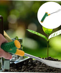 Versatile Garden Shovel And Pickaxe Set For Digging And Planting With Ergonomic Handle next to a small plant in soil