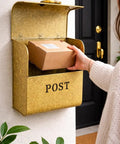 Rust Resistant Metallic Gold Wall Mount Mailbox Built Tough For Outdoors With Powder Coat Finish, parcel being inserted
