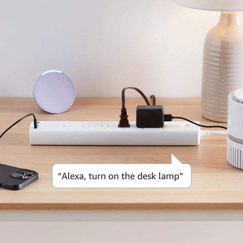 Six Outlet Smart Power Strip With Usb C Charging, Alexa Enabled Wifi Extension Cord on a desk with a lamp and phone.