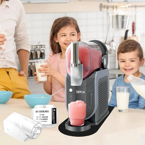 Family using slushie machine on anti slip mat with detachable shields and spout cover for slushie accessories countertop protector