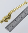 Brass Thinker Shape Cabinet Pulls And Drawer Handles For Cabinets next to ruler, solid brass hardware with figurine design.