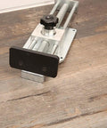 Quick Release Flooring Jack For Hardwood Floors Medium Duty Lightweight with galvanized steel, aluminum body, and soft rubber pad on wood floor.