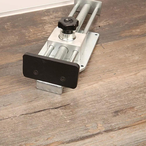 Quick Release Flooring Jack For Hardwood Floors Medium Duty Lightweight with galvanized steel, aluminum body, and soft rubber pad on wood floor.