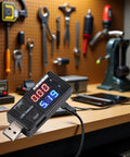 USB Power Meter And Current Tester For 3 To 9V 0 To 5A With LCD Display Voltage Detector USB Charger Tester on workbench