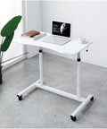 No Sweat Height Adjustable Laptop Desk with Smooth Glide Casters, Chic Minimalist Overbed Table and Portable Rolling Workstation for Home Office Daily Grind or Lazy Weekend Setup, Fresh White in modern setting with laptop.