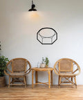 Modern Industrial Geometric Metal Wall Art Panel Premium Sturdy Home Decor Finish For Living Room Bedroom Accent Minimalist Shelf Display Top Shelf Solid Build No Fuss Everyday Space Refresh Black on white wall above rattan chairs.