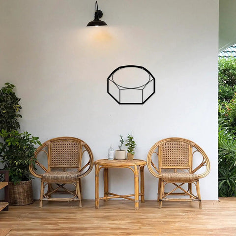 Modern Industrial Geometric Metal Wall Art Panel Premium Sturdy Home Decor Finish For Living Room Bedroom Accent Minimalist Shelf Display Top Shelf Solid Build No Fuss Everyday Space Refresh Black on white wall above rattan chairs.