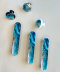 4 Pack Aqua Aquamarine Blue Water Cabinet Pulls, 3.75 Inch Hole Center, Silver Kitchen Cabinet Hardware layout on grey surface