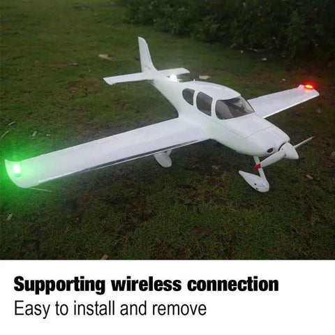 RC plane with Water Droplet Shaped Wireless RC Plane LED Light Kit, green and white flashing LED lights, on grass