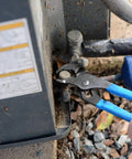 V Jaw Tongue And Groove Pliers Set With Dipped Handles adjusting pipe fitting next to utility box during home repair
