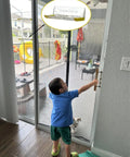 Child reaching for a sliding glass door with No Drill Easy Install Adhesive Sliding Glass Door Lock 2 Pack For Baby Proofing And Pet Safety Quiet Soft Impact Stopper Security Latch For Patio Doors Windows Closet Doors Sliding Windows installed.