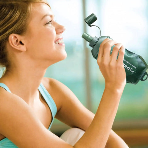 Person using Foldable TPU Water Pouch Bottle For Outdoor Hydration Leakproof And Refillable Soft Flask Lightweight And Compact Hydration Bag