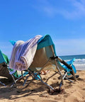 Person relaxing in Low Profile Beach Chair 2 Pack For Adults Folding And Portable With Cup Holder And Carry Bag at the beach