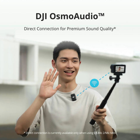 Person using DJI OsmoAudio with Osmo Action 4 Waterproof Action Camera Bundle With 4K 120fps on selfie stick, smiling and waving.